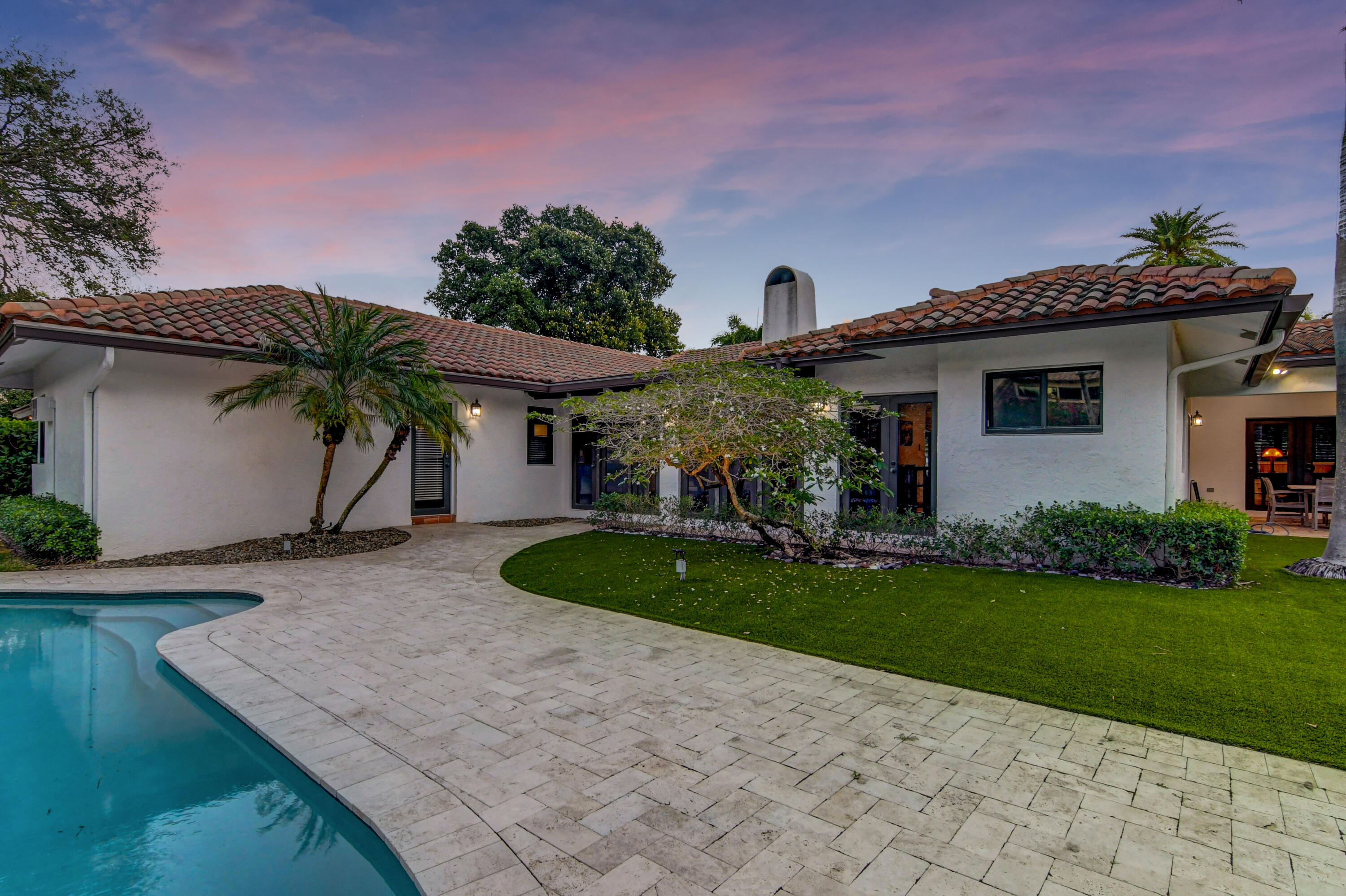 921 Southwest 20th Street Boca Raton, FL 33486 - Photo 53 of 56 a front view of a house with garden