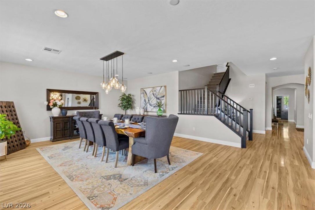 10334 Mopan Road Las Vegas, NV 89178 - Photo 13 of 28 The formal dining area seats ten and opens to both the kitchen and the backyard.