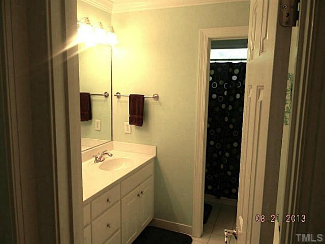 5205 Deergrass Court Raleigh, NC 27613 - Photo 18 of 25 This bathroom is bright and clean with a tub/shower and great lighting. Bathroom