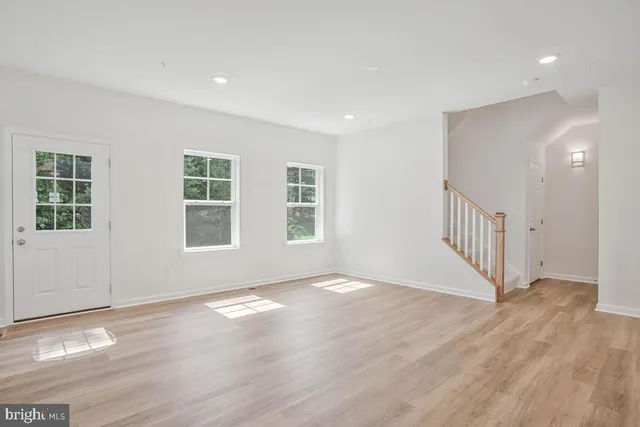 an empty room with wooden floor