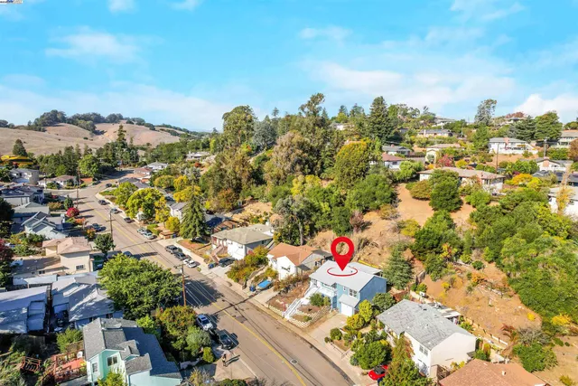 a view of a patio with a table and chairs