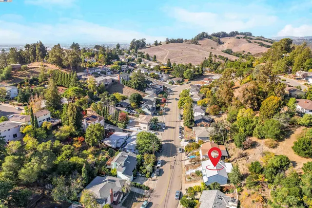 a view of a porch with a table and chairs