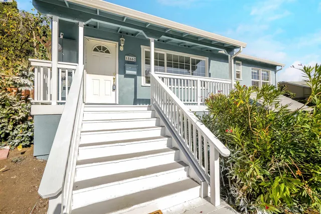 a view of a house with wooden floor and fence