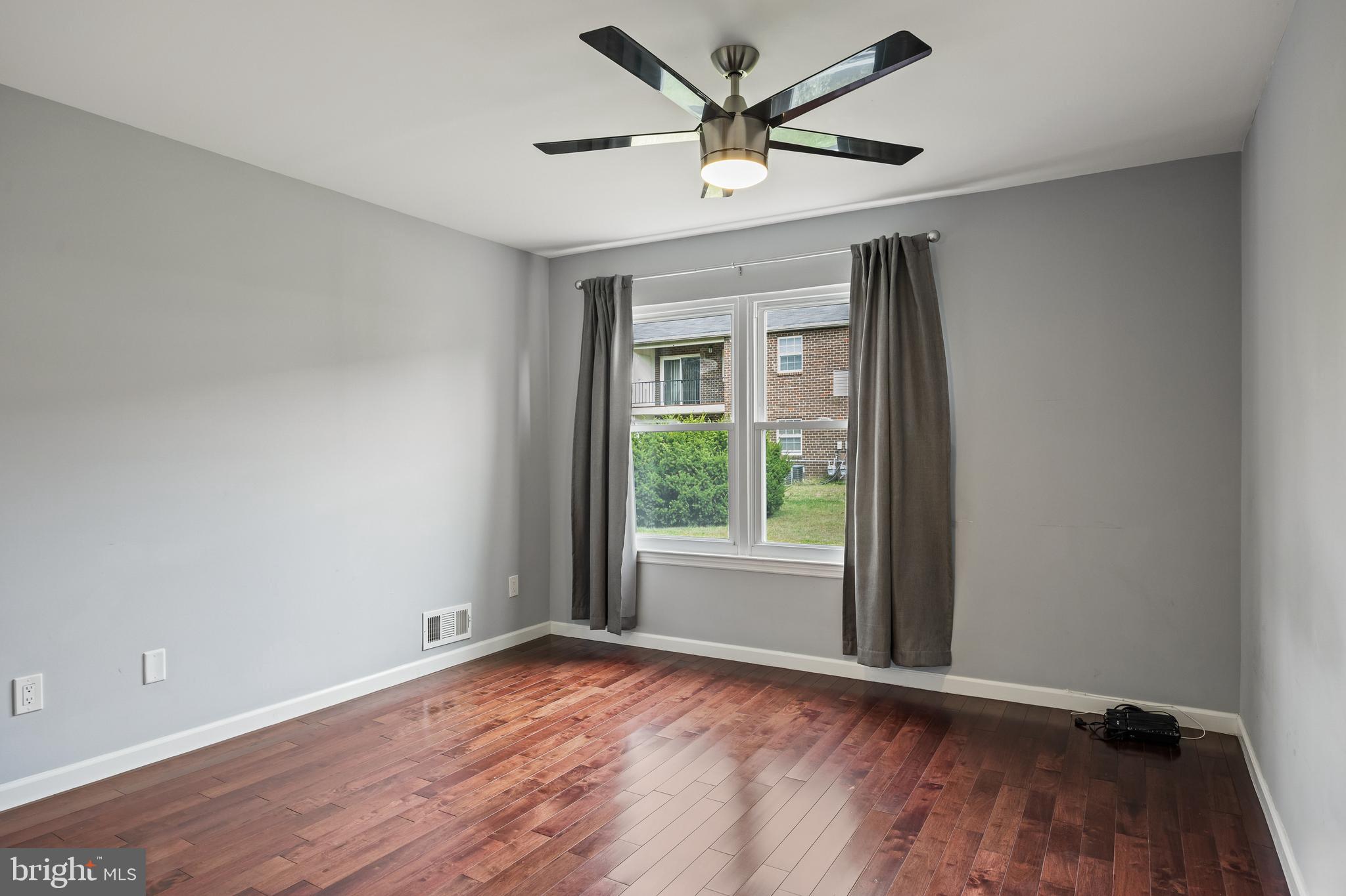 103 Sandstone Court Lumberton, NJ 08048 - Photo 13 of 25 an empty room with a window and a ceiling fan