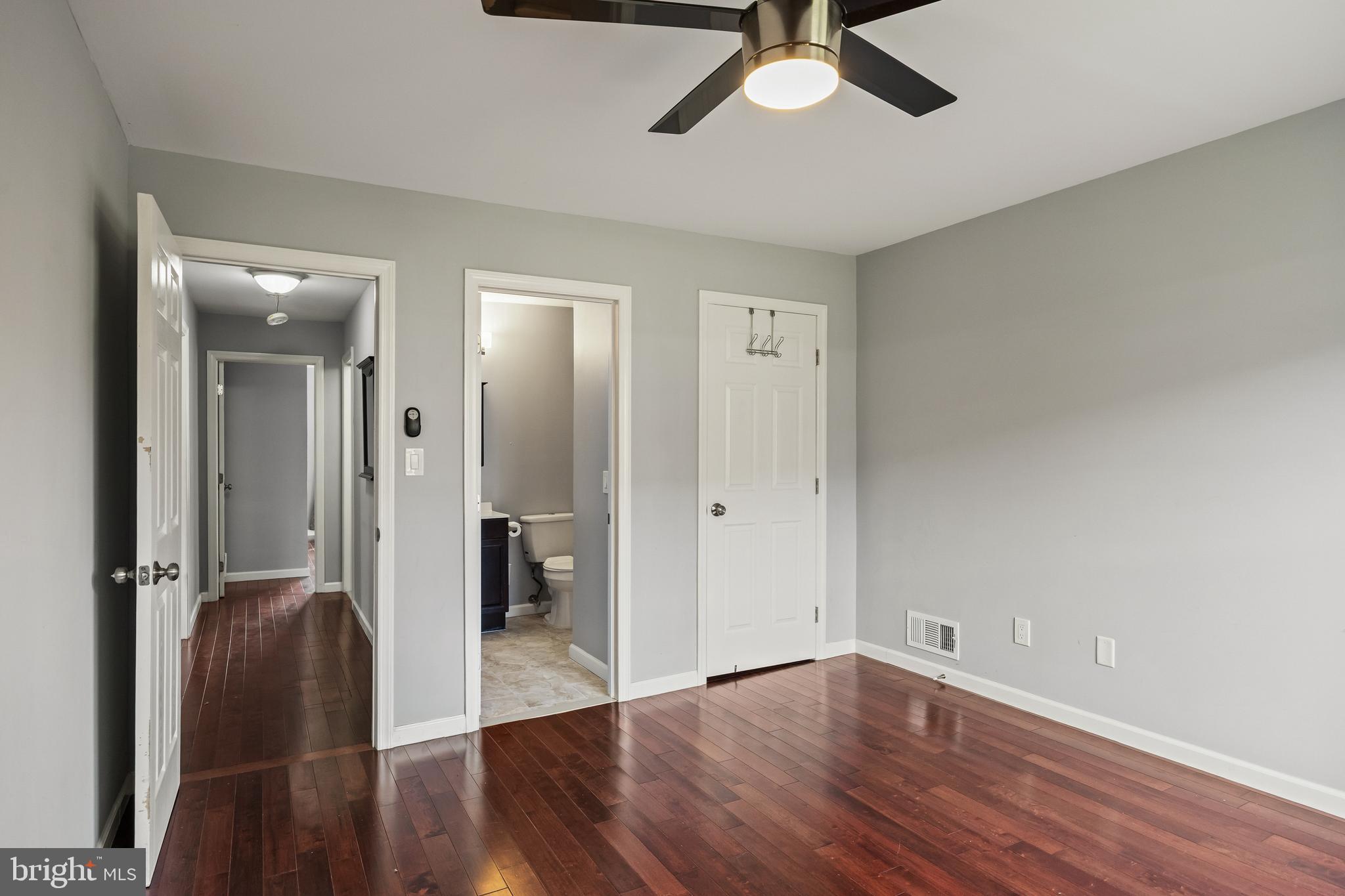 103 Sandstone Court Lumberton, NJ 08048 - Photo 16 of 25 an empty room with wooden floor and windows