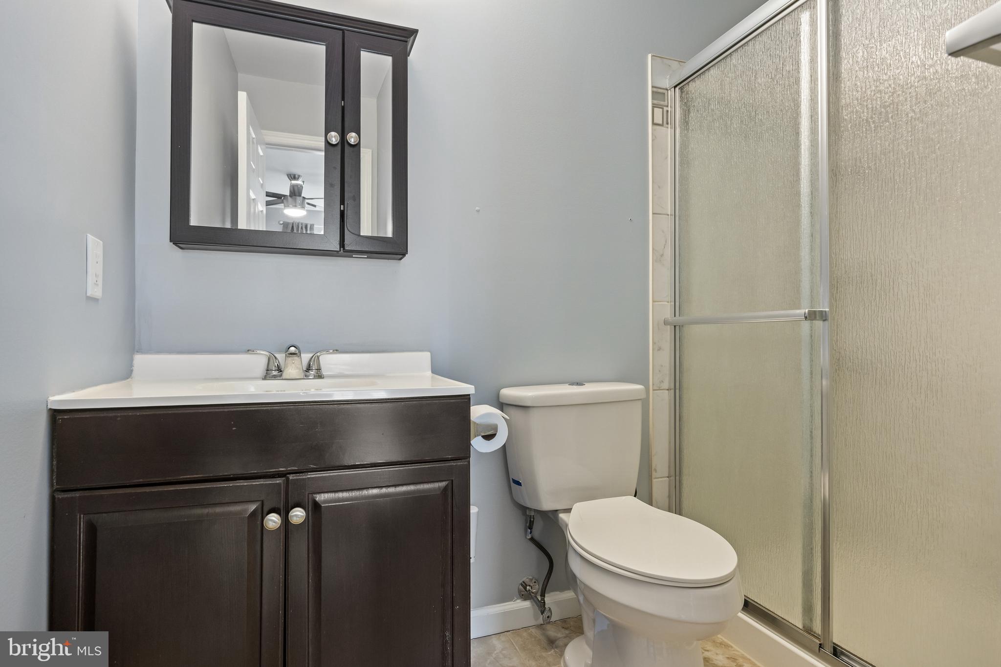 103 Sandstone Court Lumberton, NJ 08048 - Photo 17 of 25 a bathroom with a toilet sink and mirror