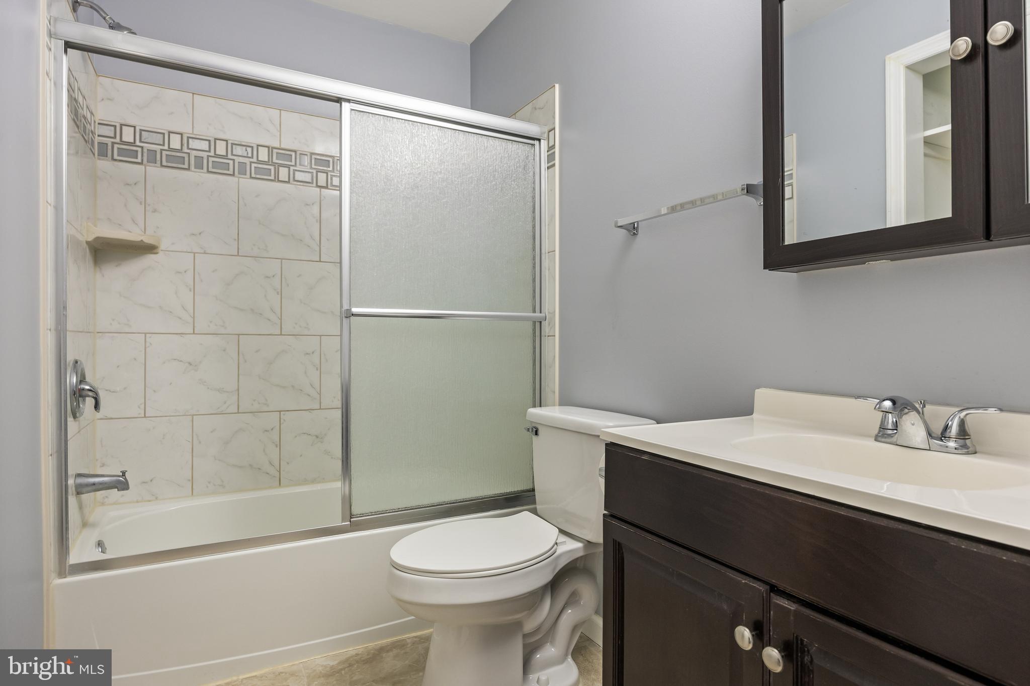 103 Sandstone Court Lumberton, NJ 08048 - Photo 18 of 25 a bathroom with a sink a toilet and shower