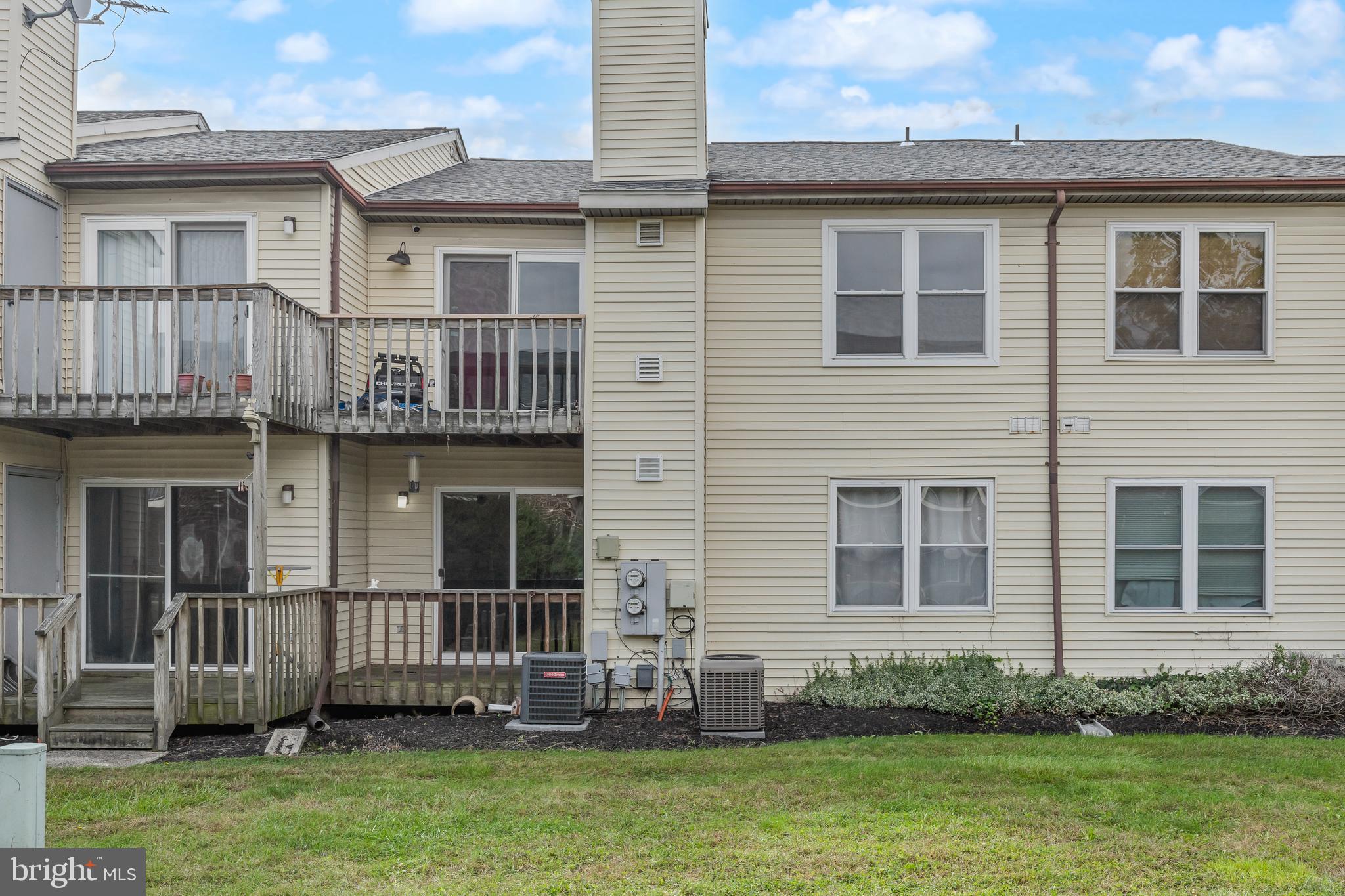 103 Sandstone Court Lumberton, NJ 08048 - Photo 22 of 25 a front view of a house with a yard