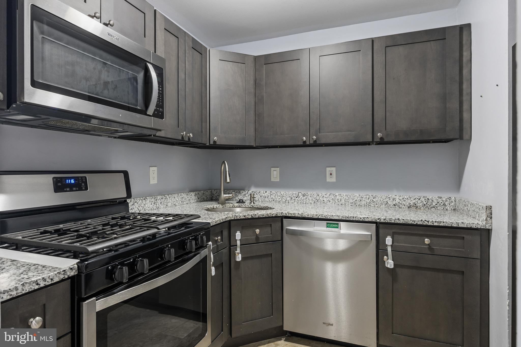 103 Sandstone Court Lumberton, NJ 08048 - Photo 6 of 25 a kitchen with stainless steel appliances granite countertop a stove and a microwave