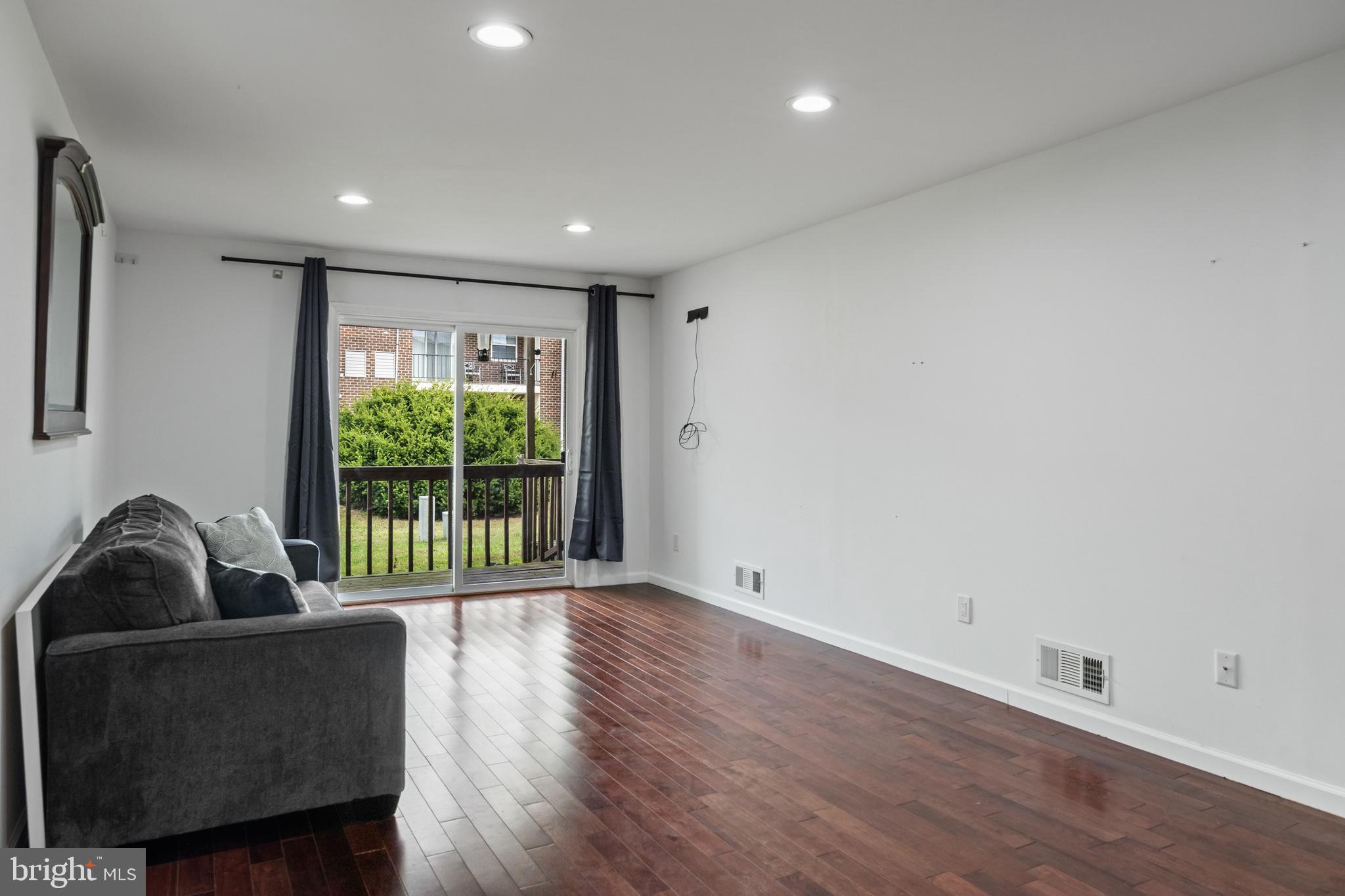 103 Sandstone Court Lumberton, NJ 08048 - Photo 10 of 25 a living room with furniture and a large window