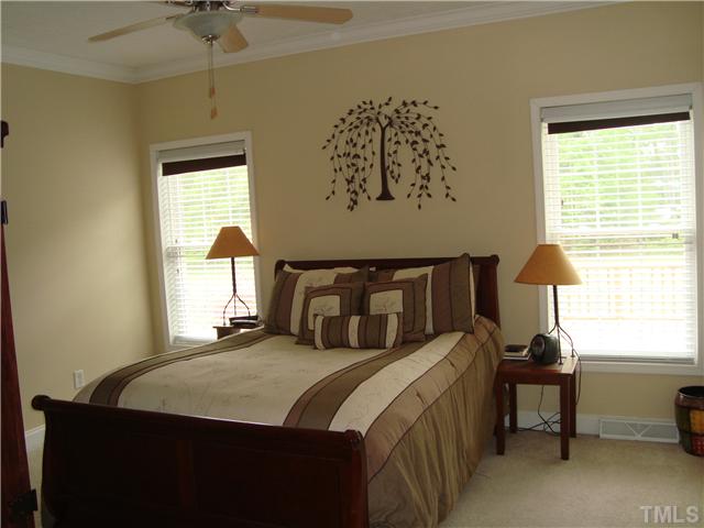906 Oak Grove Mount Zion Road Roxboro, NC 27574 - Photo 6 of 11 a bedroom with a bed and a window