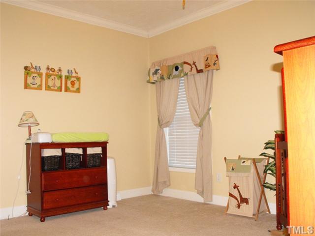 906 Oak Grove Mount Zion Road Roxboro, NC 27574 - Photo 7 of 11 a view of a room with furniture and a ceiling fan