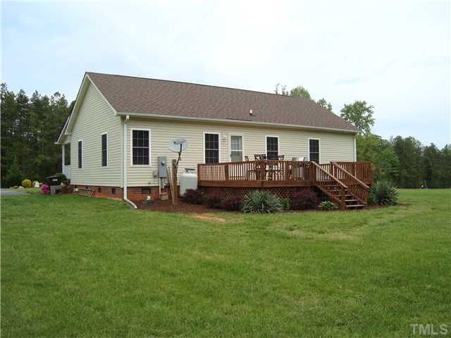 906 Oak Grove Mount Zion Road Roxboro, NC 27574 - Photo 8 of 11 a view of a house with a backyard