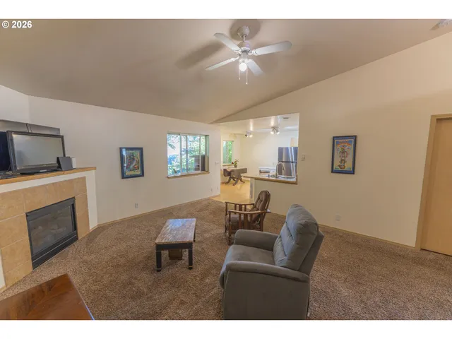 a view of empty room with a fireplace