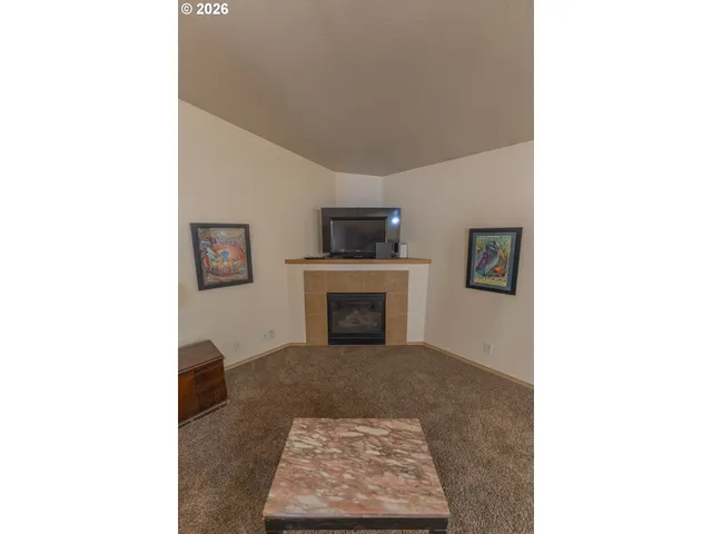 a living room with furniture a dining table and kitchen view