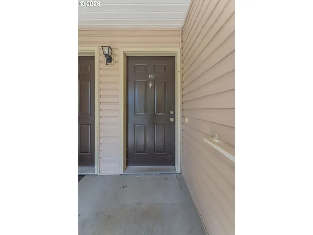 a bathroom with a shower and a glass door