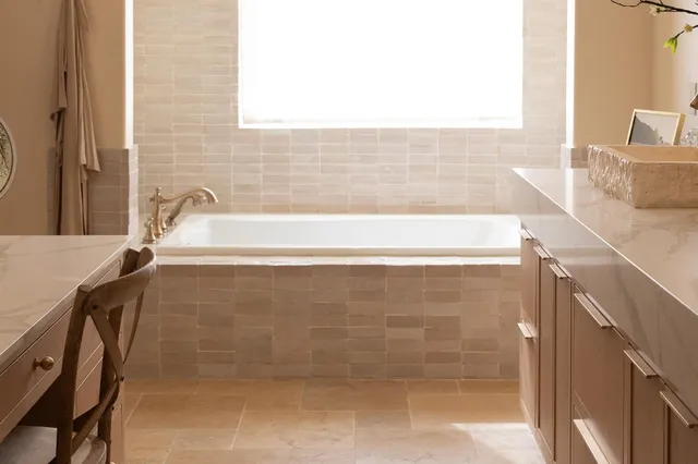 a bathroom with a bathtub and a sink