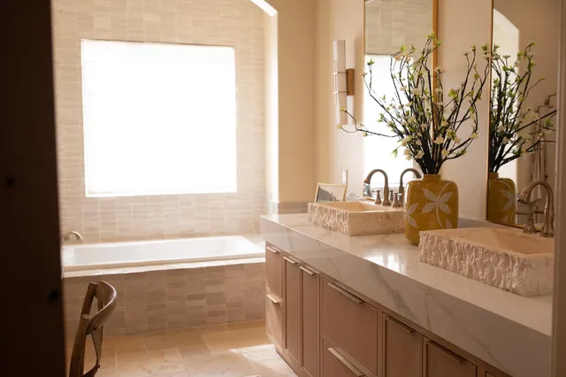 a bathroom with a shower and a sink