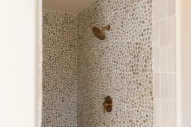 a view of a kitchen with white cabinets