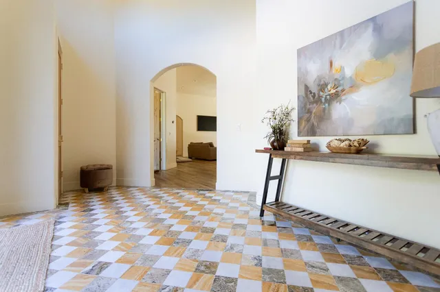 a bedroom with a bed and a television