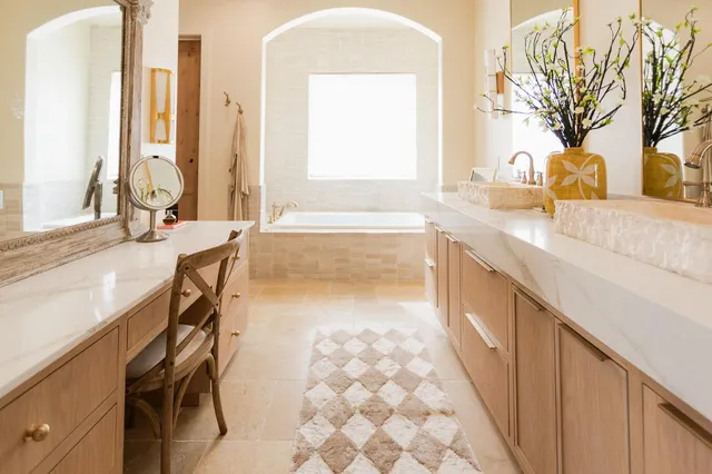 a view of an empty room with wooden floor and cabinet