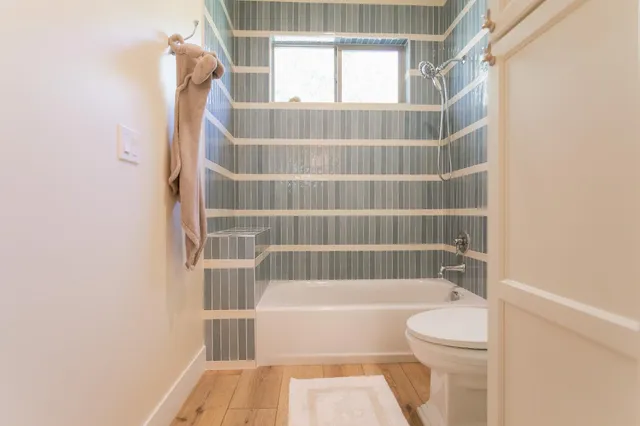 a hallway with a sink and a mirror