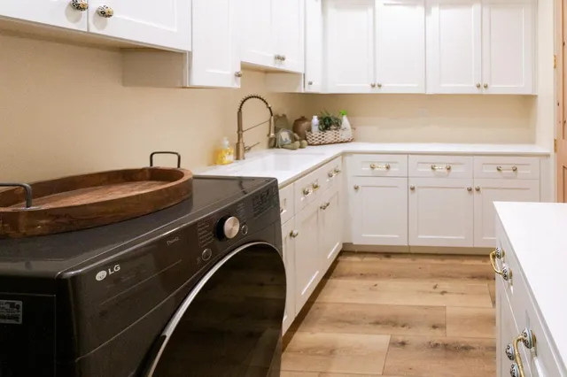 a bathroom with a sink a mirror and vanity