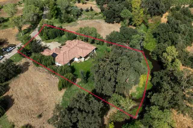 an aerial view of lake residential house with outdoor space and river