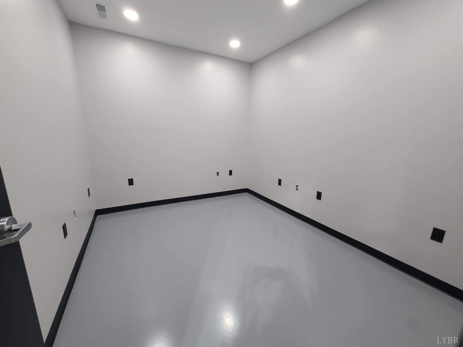 45 Depot Road, Unit 1 Rustburg, VA 24588 - Photo 6 of 10 an empty room with wooden floor and windows