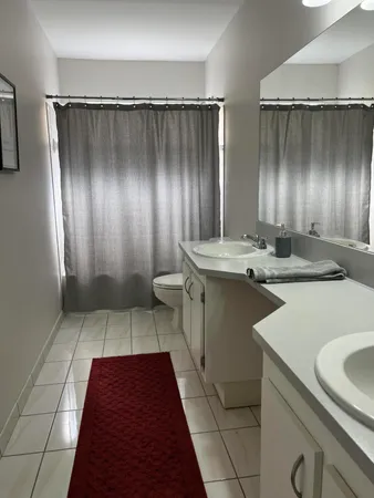 a kitchen with sink cabinets and stainless steel appliances