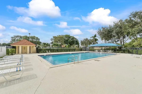 a view of swimming pool with a yard