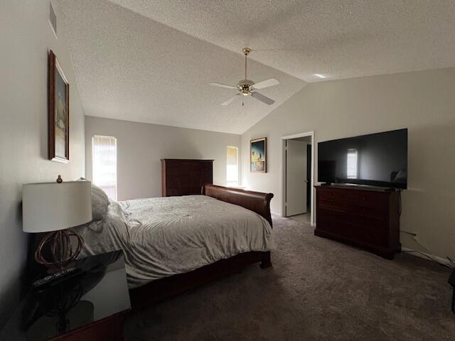 9775 Sun Pointe Drive Boynton Beach, FL 33437 - Photo 8 of 30 a bedroom with a bed and a flat screen tv
