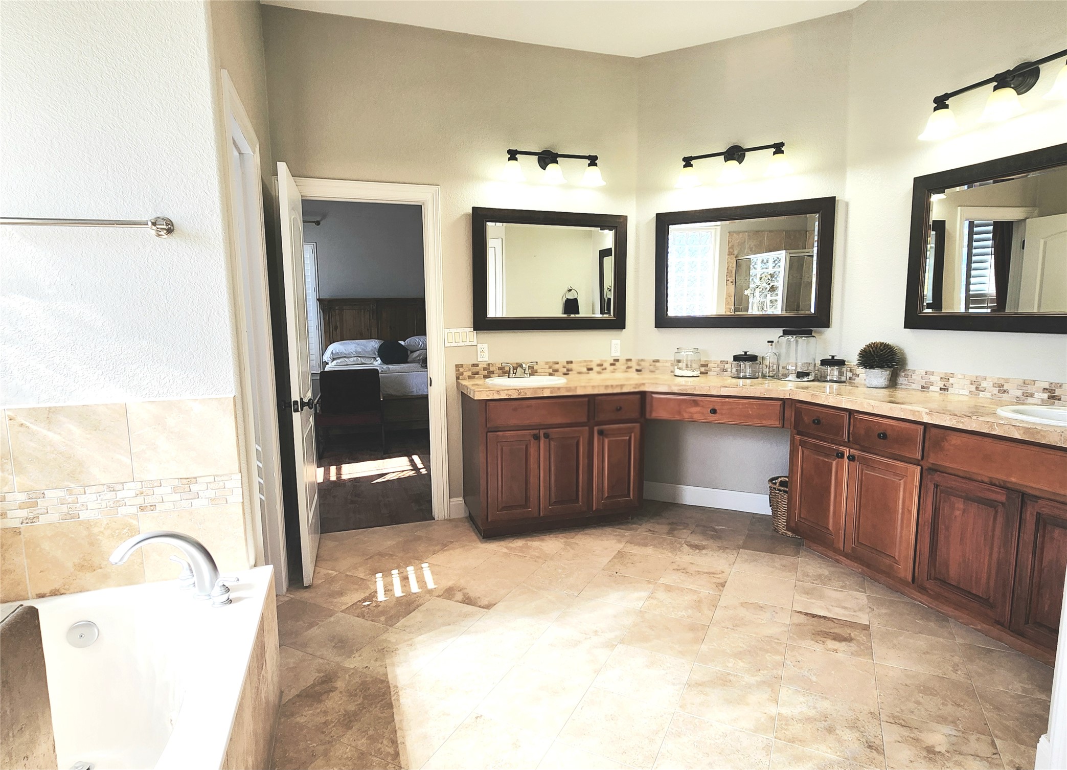 152 Silver Hawk Court Dripping Springs, TX 78620 - Photo 15 of 31 a bathroom with a tub sink and mirror