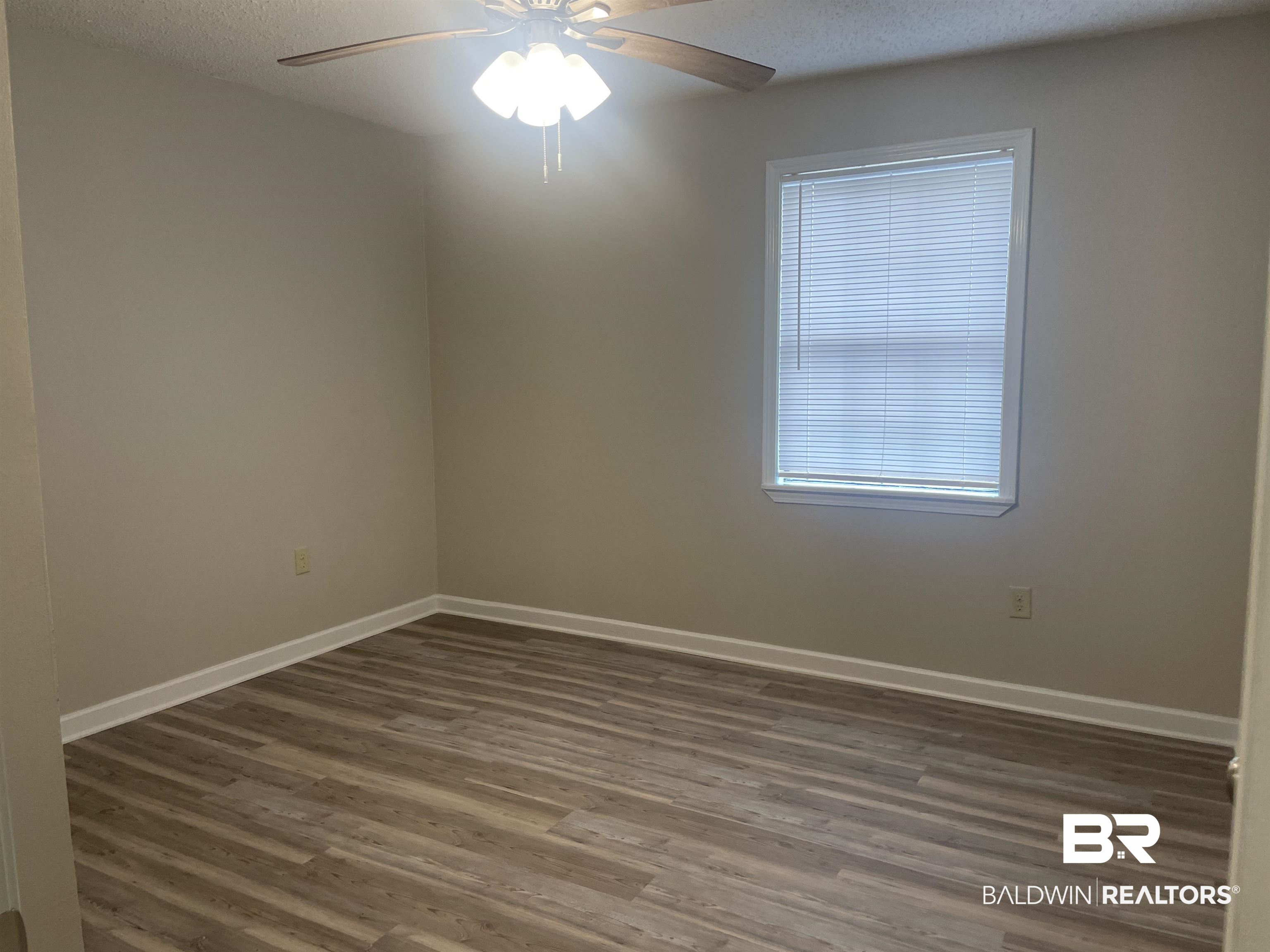 28414 Highway 31 Flomaton, AL 36441 - Photo 6 of 11 Primary Bedroom with New LVP Flooring featuring Ensuite