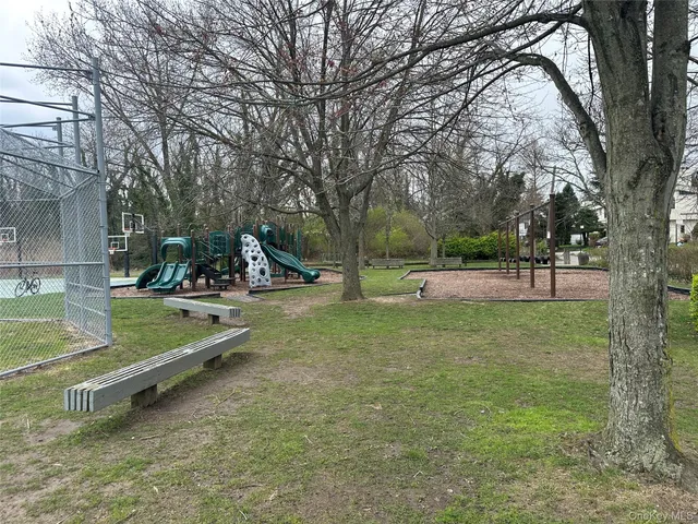a view of a park with swings and slides