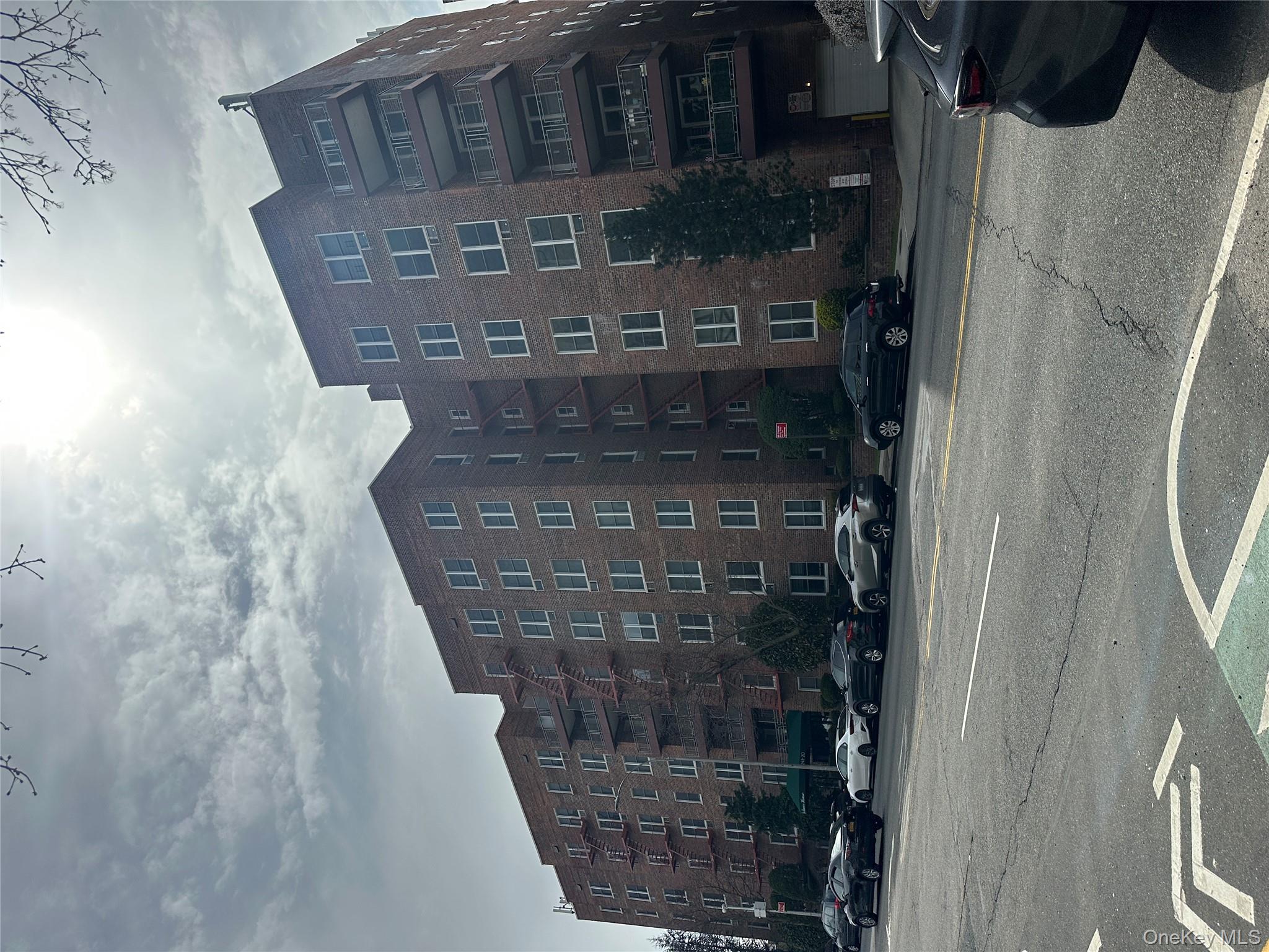 241-20 Northern Boulevard, Unit 1M Queens, NY 11362 - Photo 2 of 31 a view of a building and a street