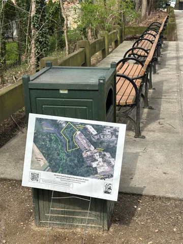 a view of swimming pool with a bench