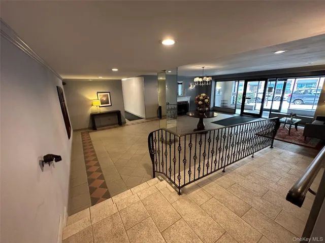 a view of a livingroom with furniture and staircase