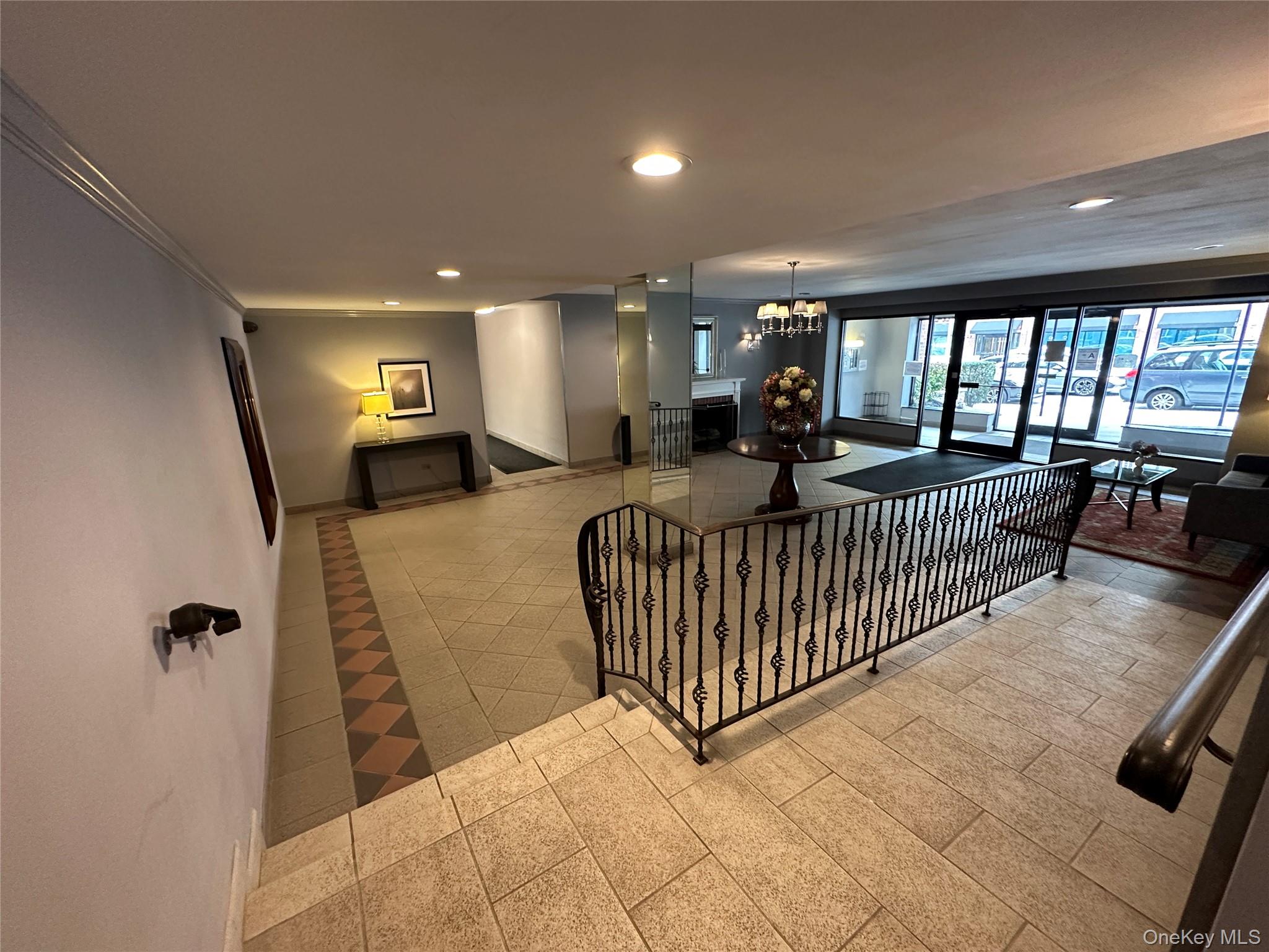 241-20 Northern Boulevard, Unit 1M Queens, NY 11362 - Photo 3 of 31 a view of a livingroom with furniture and staircase