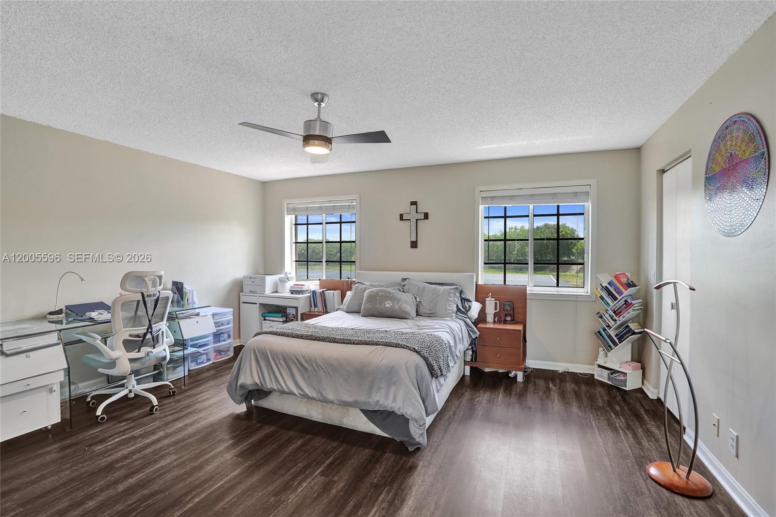 4281 Laurel Ridge Circle Weston, FL 33331 - Photo 44 of 80 a bedroom with a bed and wooden floor
