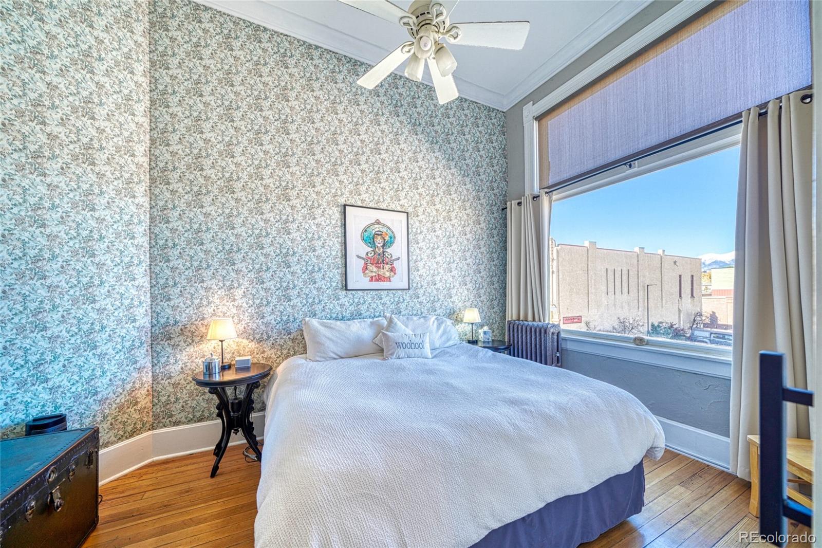 207 F Street, Unit 2 Salida, CO 81201 - Photo 18 of 23 a bedroom with a bed and a chandelier