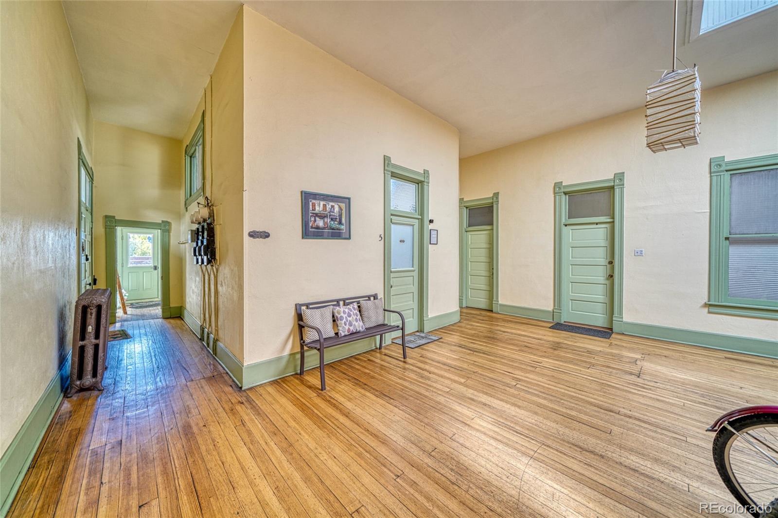 207 F Street, Unit 2 Salida, CO 81201 - Photo 5 of 23 a view of a room with wooden floor and stairs