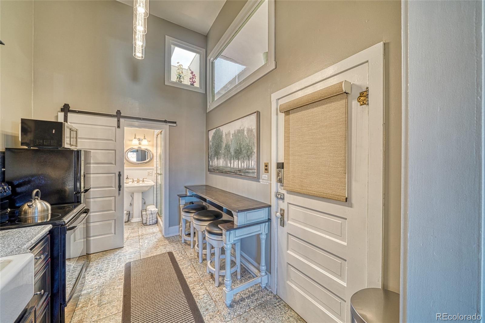 207 F Street, Unit 2 Salida, CO 81201 - Photo 8 of 23 a view of a hallway with workspace and windows