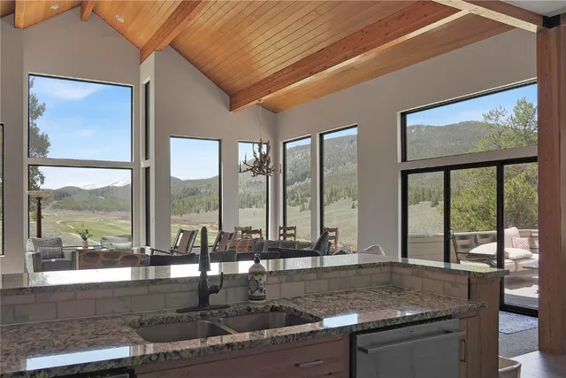 a kitchen with large windows