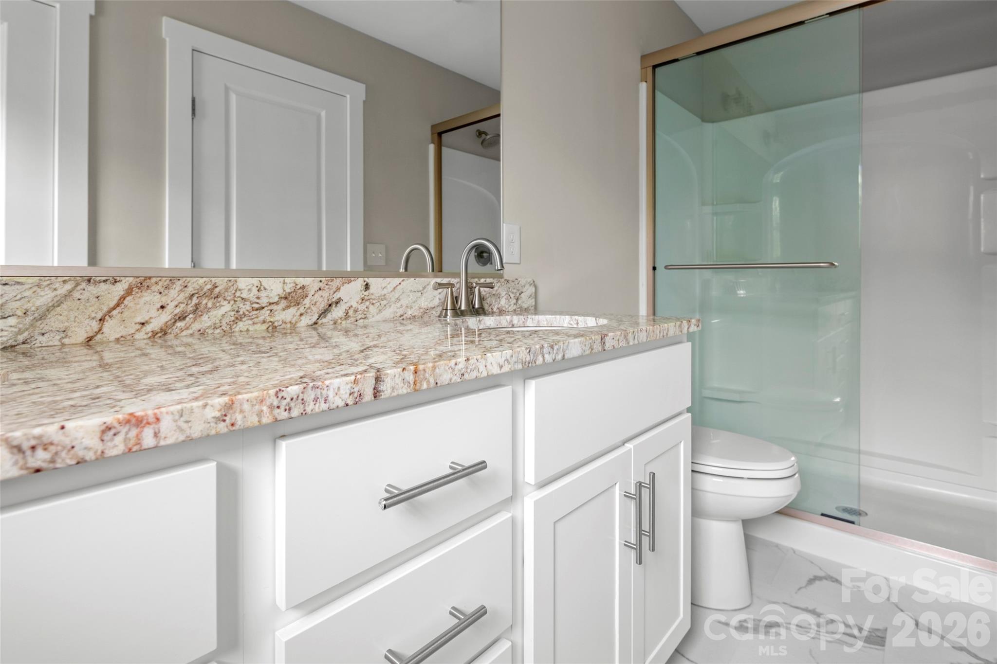 52 Wheeler Road Weaverville, NC 28787 - Photo 15 of 21 a bathroom with a granite countertop sink and a toilet