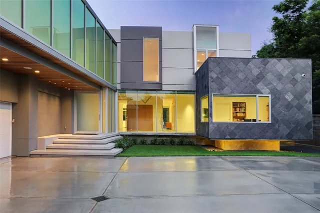 a view of a brick building with a yard