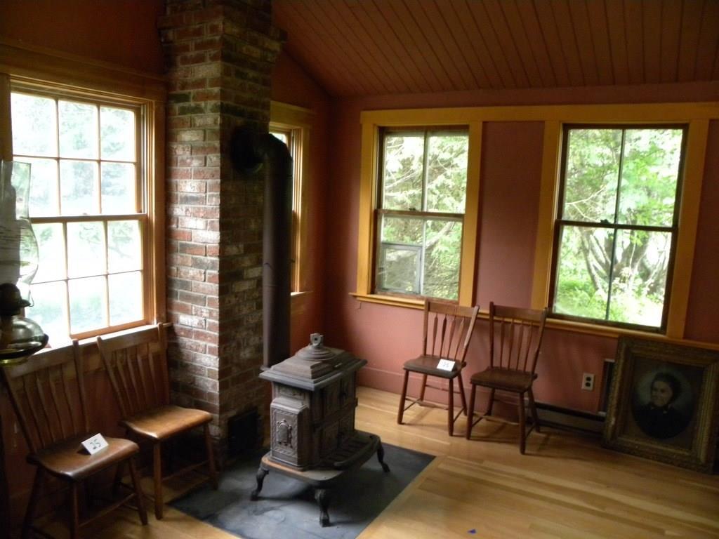 1968 Appleton Ridge Road Appleton, ME 04862 - Photo 10 of 33 Dining room parlor stove