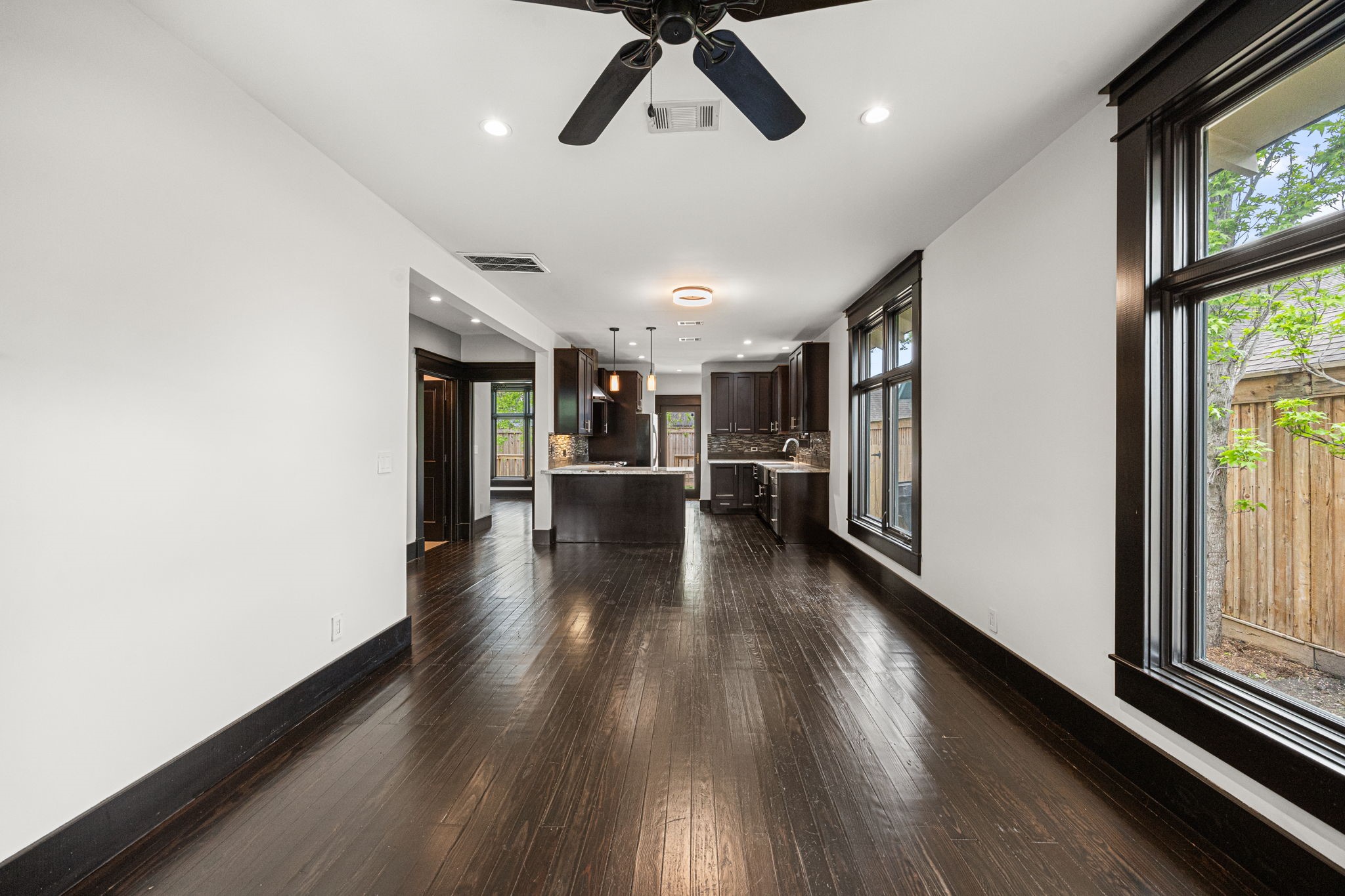 1115 Adele Street Houston, TX 77009 - Photo 5 of 19 Bright living space with hardwood floors and direct views into the kitchen.