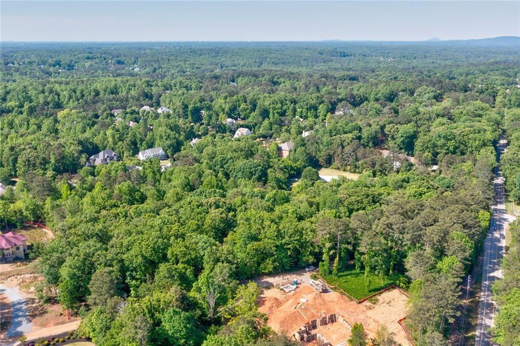 1265 Summit Road Milton, GA 30004 - Photo 5 of 11 a view of a city with lush green forest