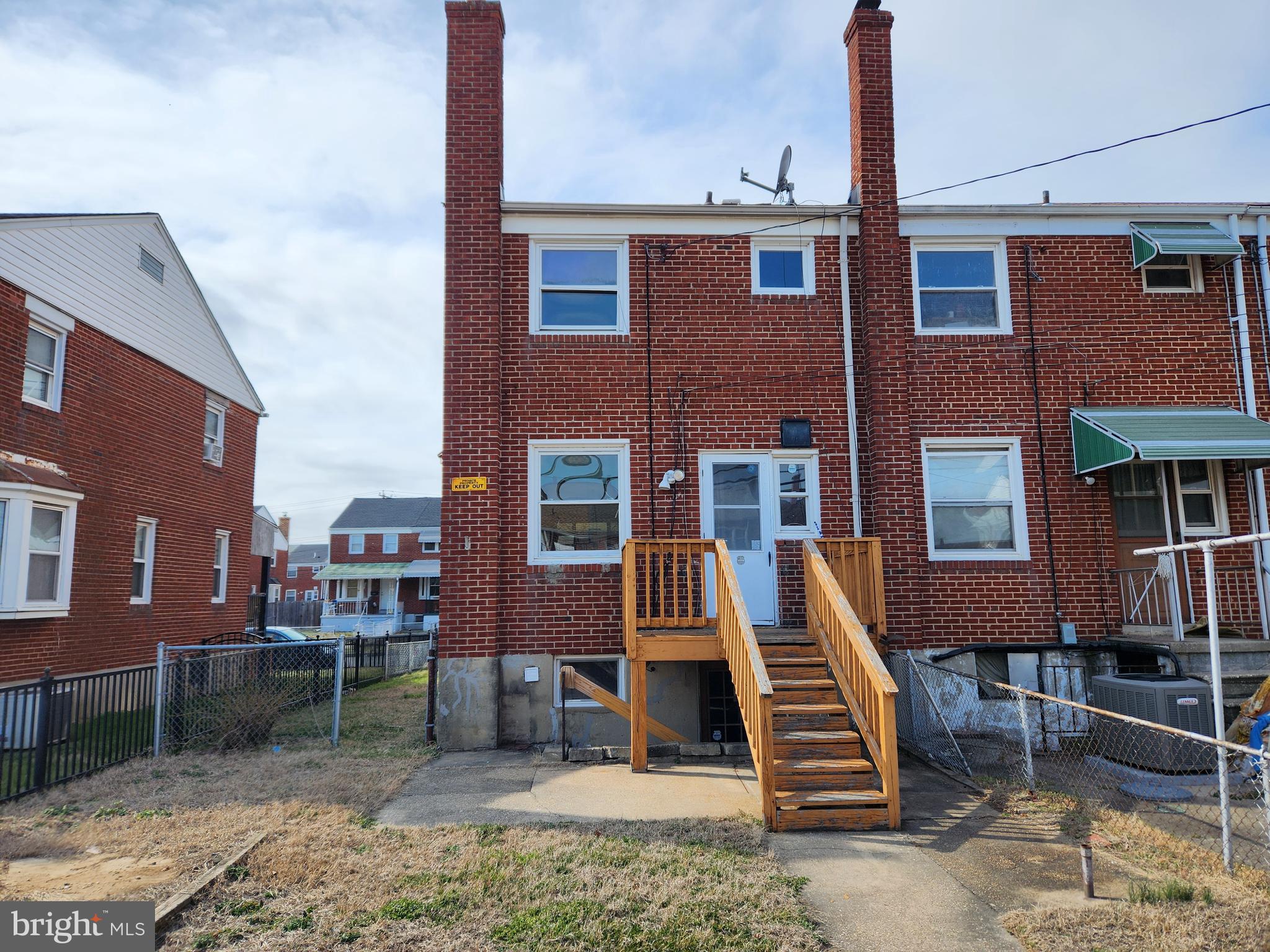 2041 Jasmine Road Baltimore, MD 21222 - Photo 21 of 21 a front view of a house with a yard